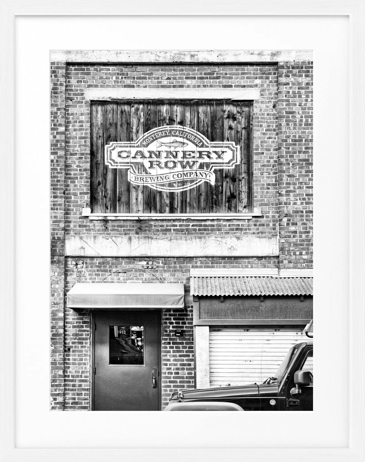 Schwarz-weiß Poster mit Rahmen von Cosman-Photocollection, Kalifornien Cannery Row in Monterey, 25x31 cm, stilvolles Wandbild