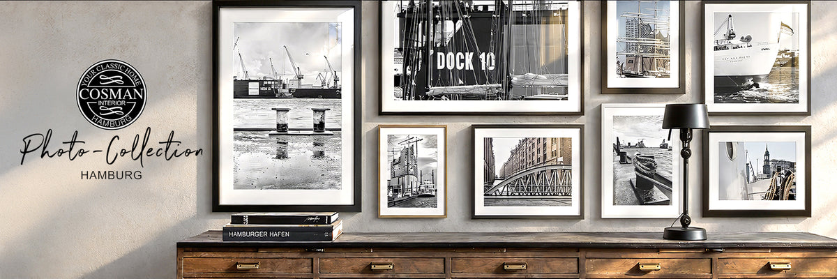 Framed black and white photographs of the Port of Hamburg above a sideboard next to the Cosman Photo-Collection logo.